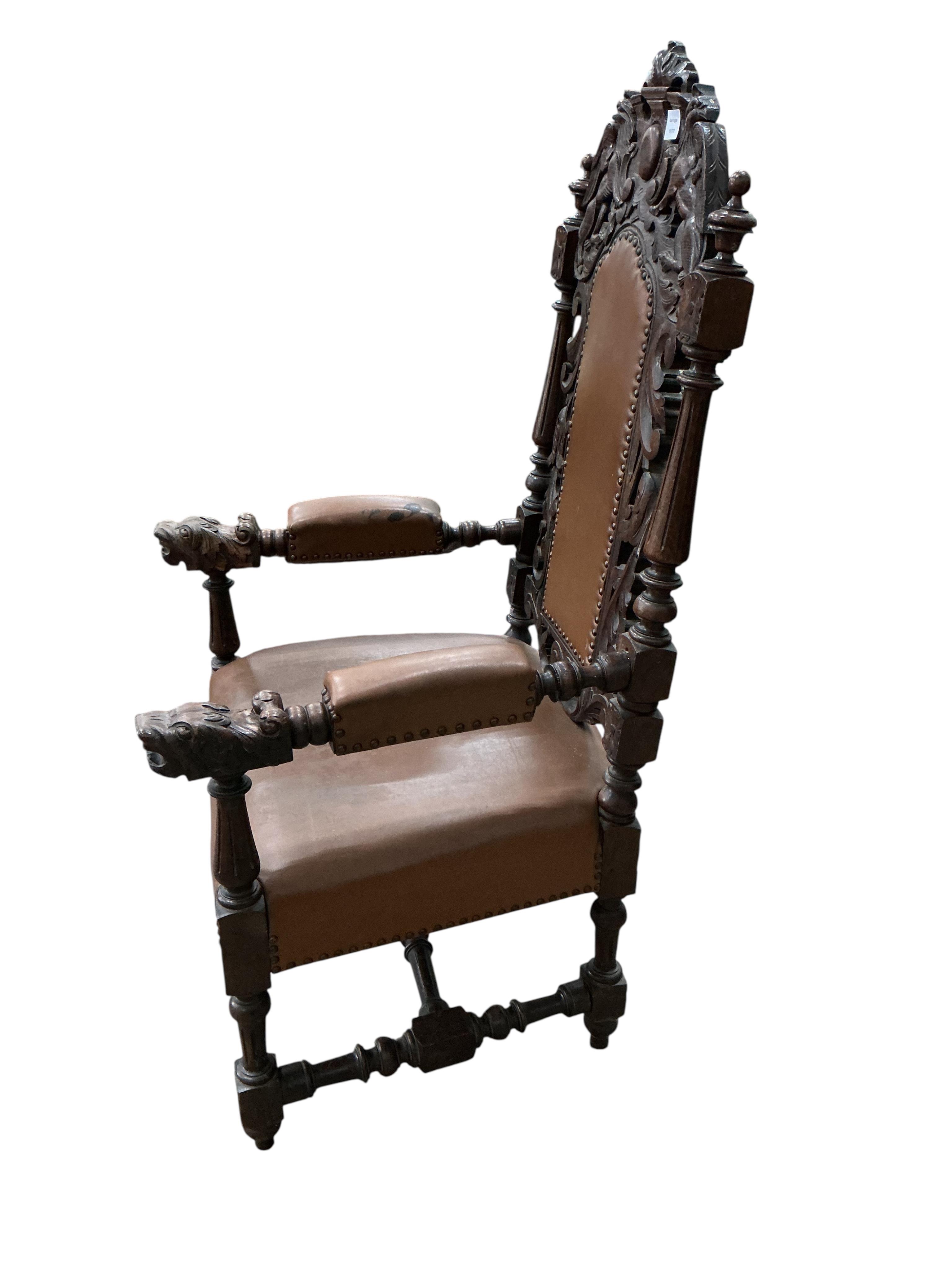 A late Victorian carved oak high backed elbow chair, width 66cm, depth 63cm, height 130cm